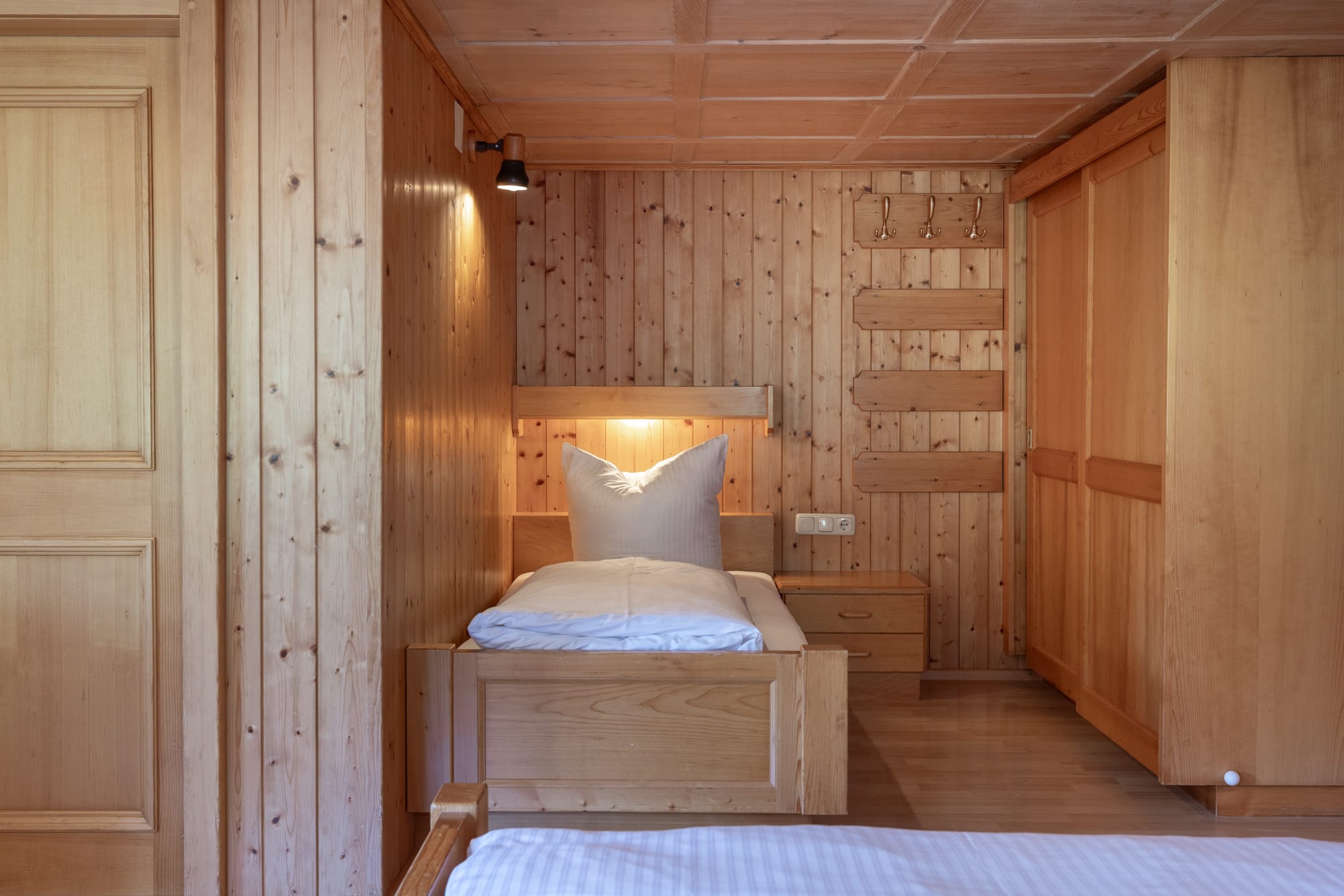 Einzelbett im Schlafzimmer im Apartment Bergrößle XL